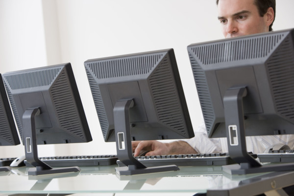 Businessman typing on computer.