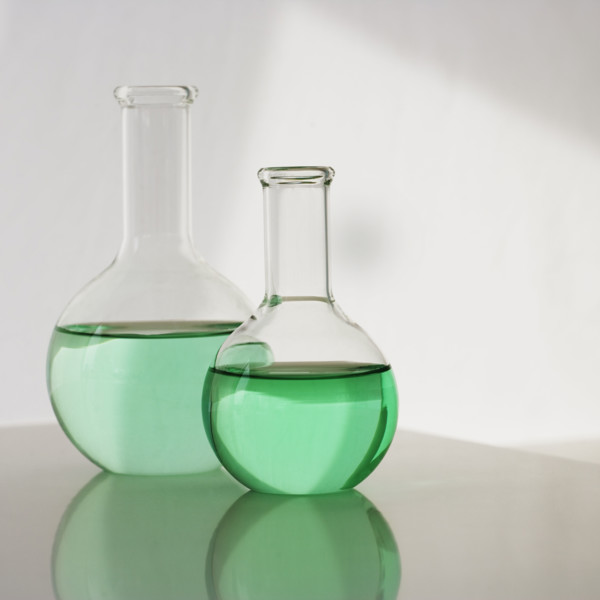 Two beakers with liquid.