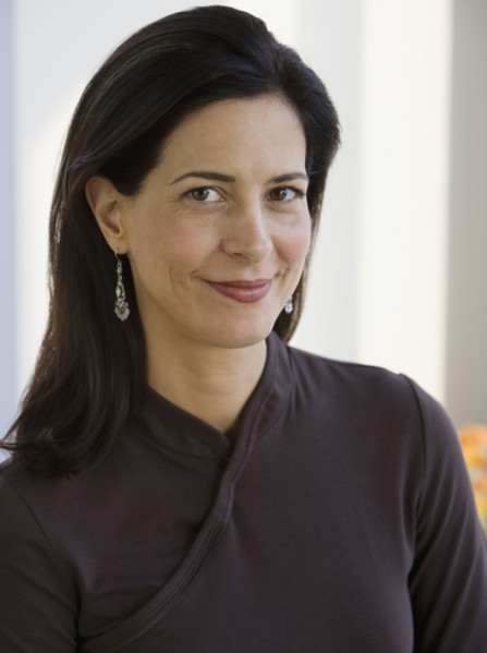 Close up of woman smiling.