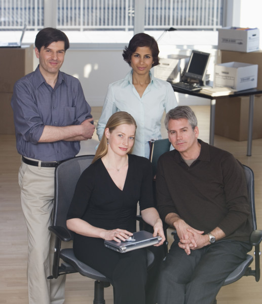 Group of businesspeople in new office.