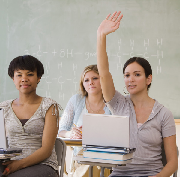 Ethnic-ethnic women in classroom.