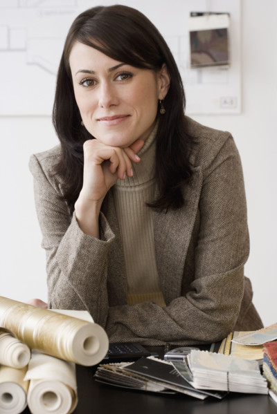 Portrait of female interior designer at shop.