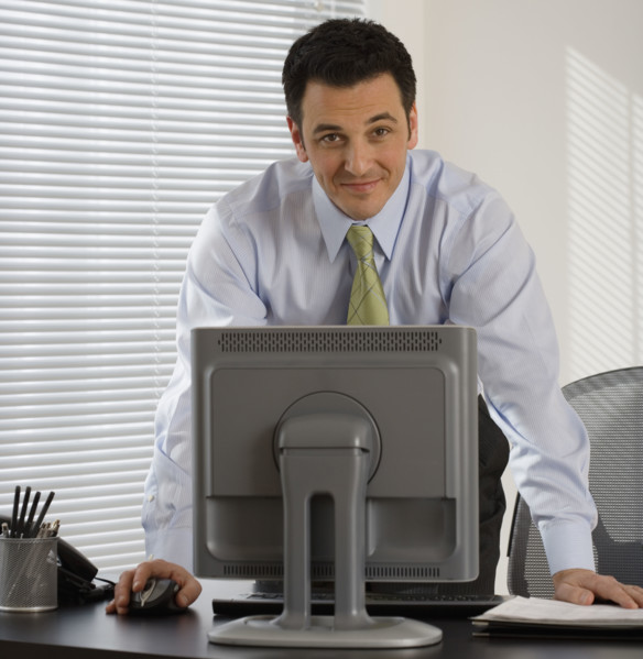 Portrait of businessman at desk.