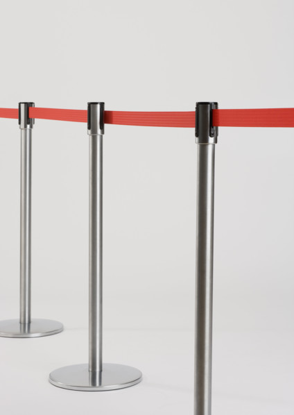 Studio shot of retractable belt crowd control barriers.