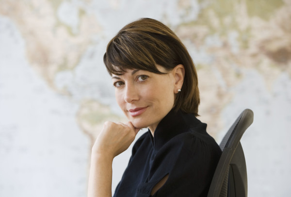 Portrait of businesswoman in chair.