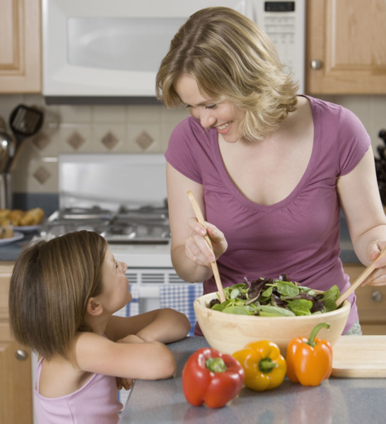 Mother and daughter smiling at each other.