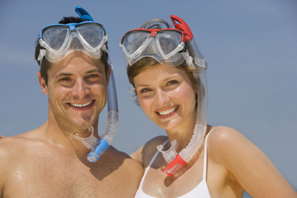Couple wearing snorkeling gear.