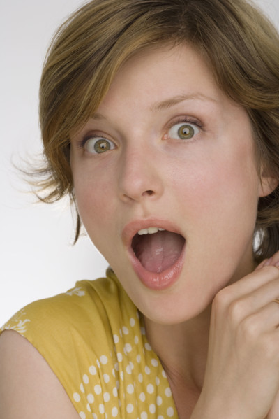 Close up of woman looking surprised.