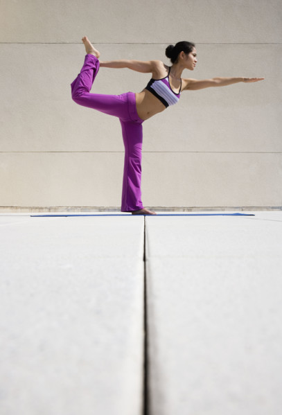 Woman practicing yoga.