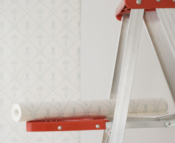 Roll of wallpaper on ladder shelf. Date : 2006