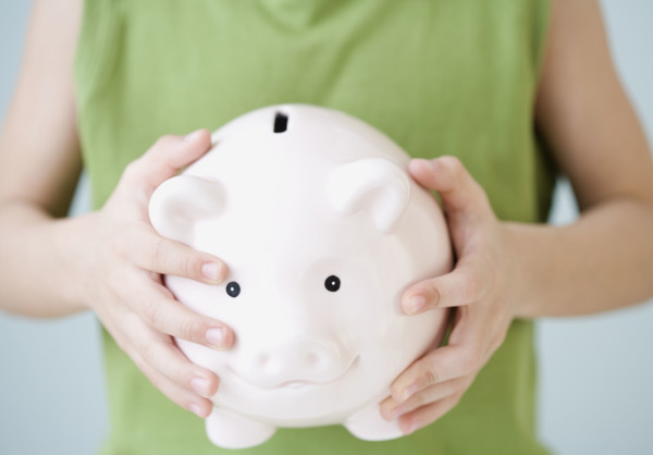 Boy holding piggy bank. Date : 2007