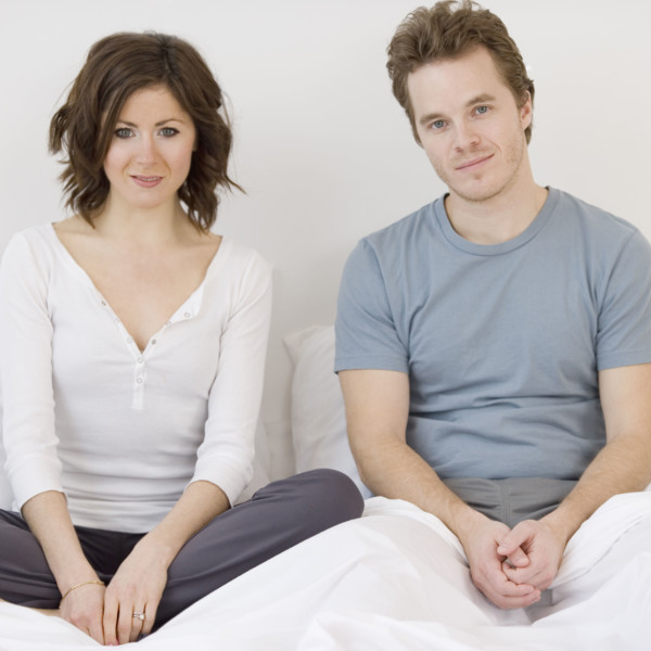 Couple sitting in bed. Date : 2007