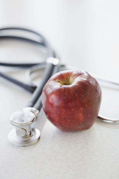Close up of apple and stethoscope. Date : 2006