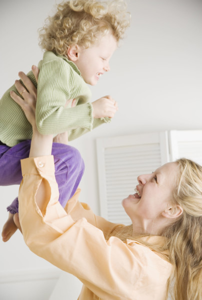 Mother playing with her daughter. Date : 2006