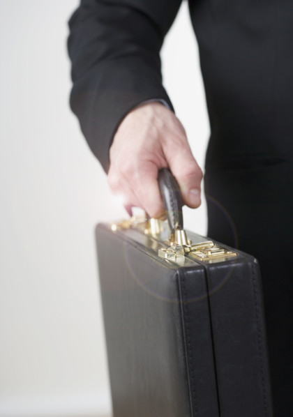 Businessman carrying a briefcase. Date : 2006