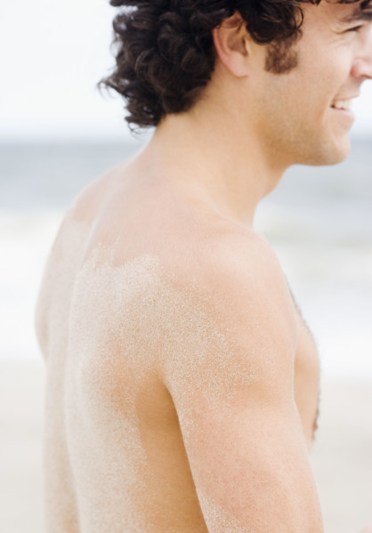 Man with sand on back. Date : 2007