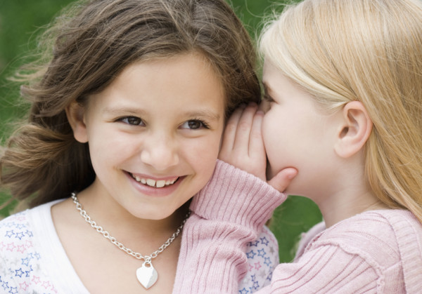Girl telling secret. Date : 2007