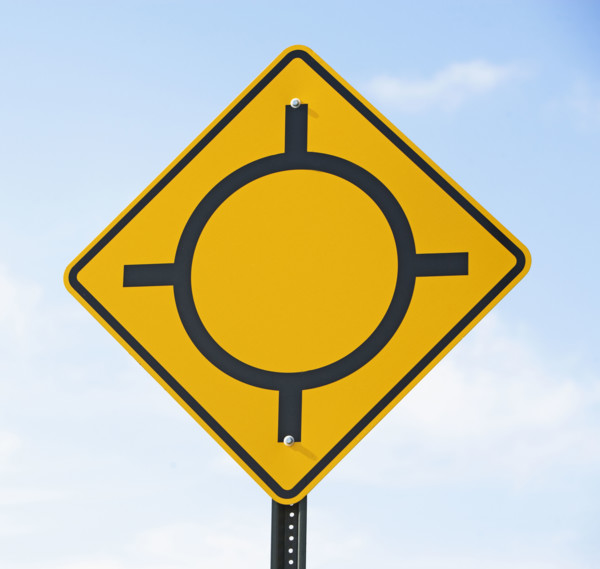 Low angle view of traffic circle sign. Date : 2007
