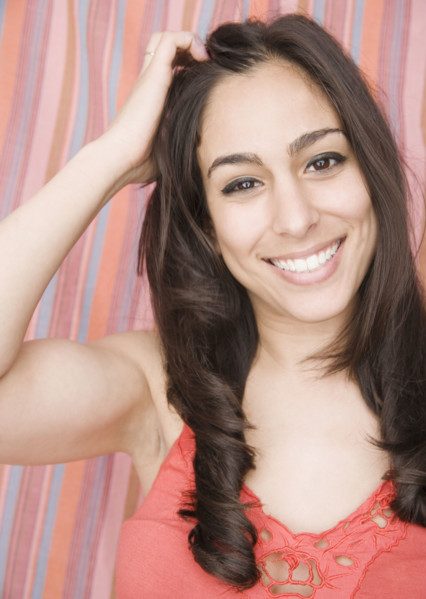 Woman with hand in hair. Date : 2007