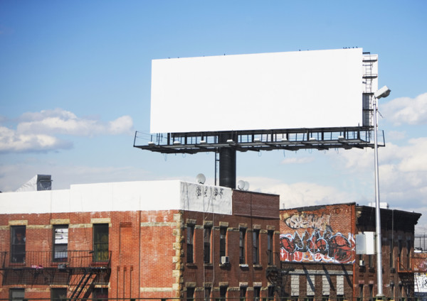 Blank billboard over urban buildings. Date : 2007