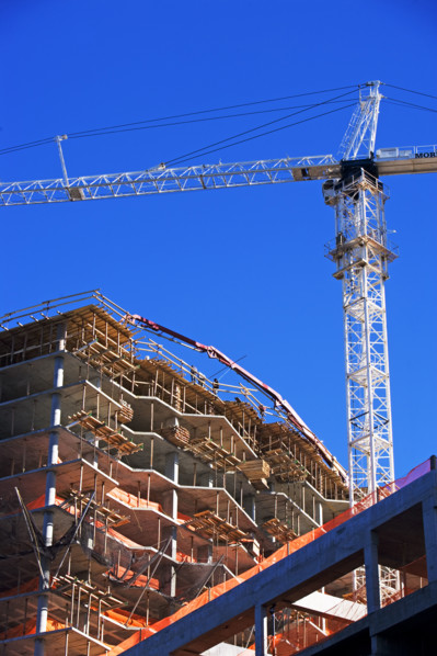 Low angle view of construction site and crane. Date : 2007
