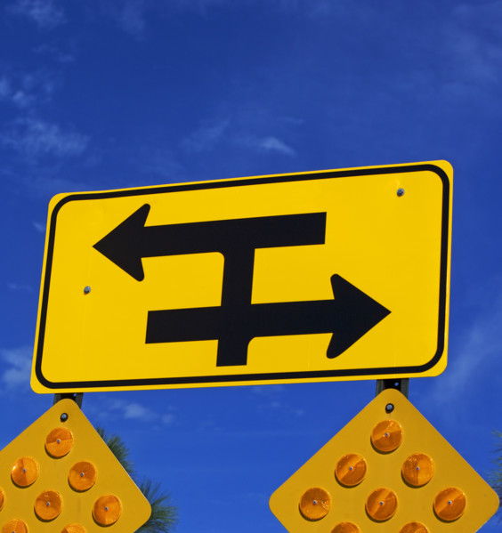 Low angle view of traffic direction sign. Date : 2007