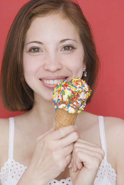 Woman eating ice cream cone. Date : 2007