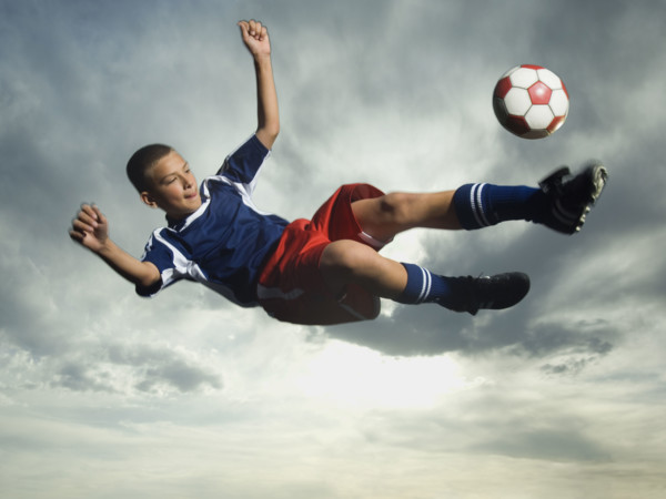 Low angle view of soccer player jumping. Date : 2007