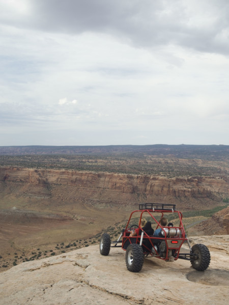 People in off-road vehicle at edge of cliff. Date : 2007