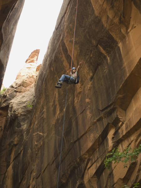 Woman canyon rappelling. Date : 2007