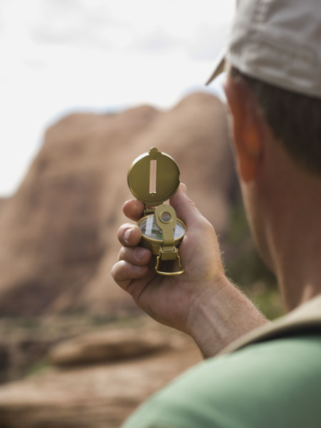 Man looking at compass. Date : 2007
