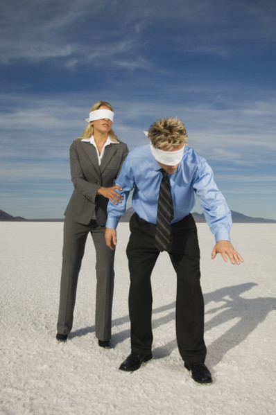 Blindfolded businesspeople on salt flats, Salt Flats, Utah, United States. Date : 2007