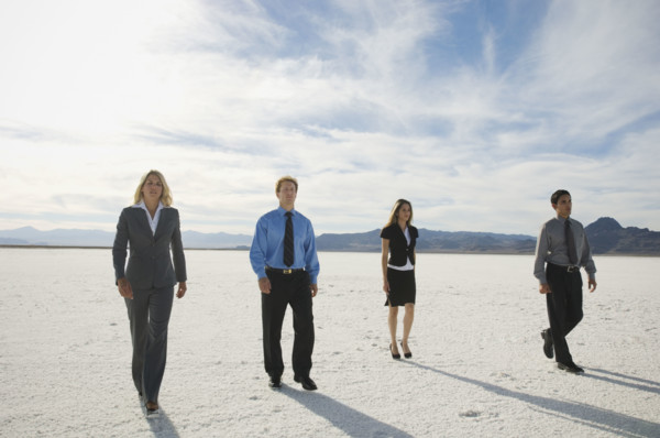 Businesspeople walking on salt flats, Salt Flats, Utah, United States. Date : 2007