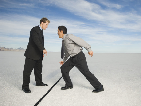 Businessmen on opposite sides of line, Salt Flats, Utah, United States. Date : 2007