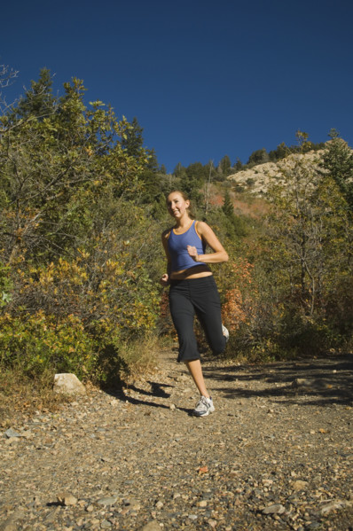 Woman jogging on trail, Utah, United States. Date : 2007