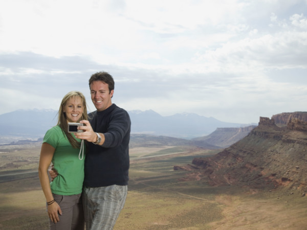 Couple taking own photograph. Date : 2007