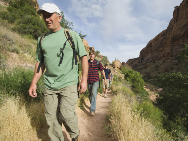 Family hiking in desert. Date : 2007