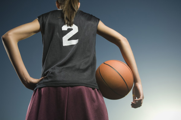 Girl holding basketball. Date : 2007
