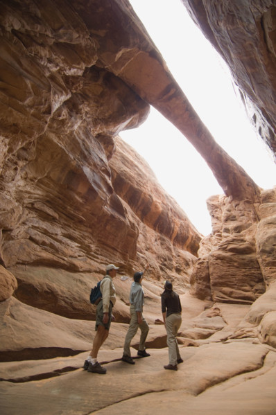 People looking up at rock formations. Date : 2007