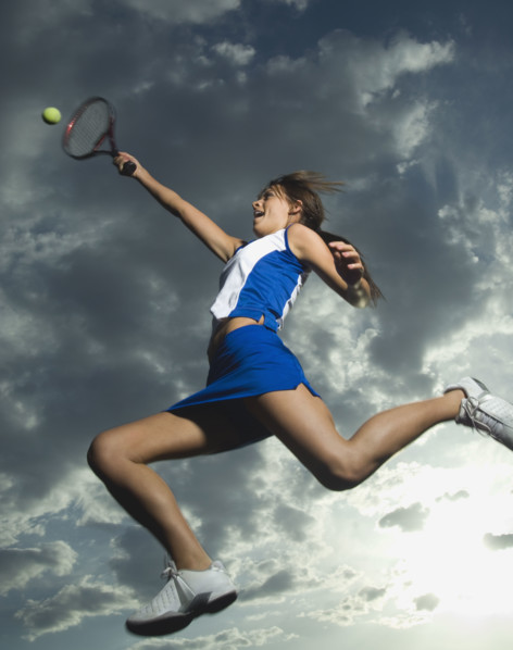 Low angle view of tennis player jumping. Date : 2007