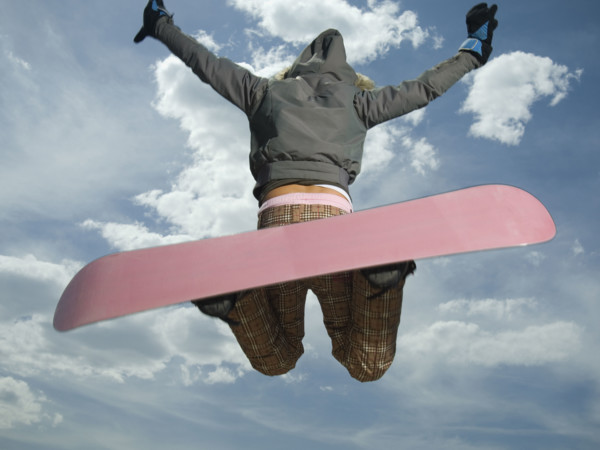 Low angle view of snowboarder jumping. Date : 2007