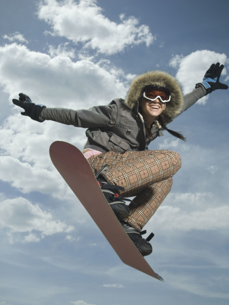 Low angle view of snowboarder jumping. Date : 2007