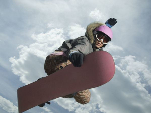 Low angle view of snowboarder jumping. Date : 2007