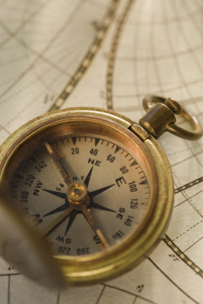 Compass on antique map.
