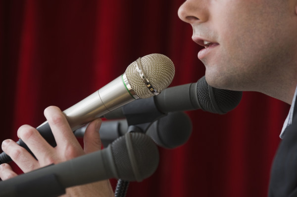Man speaking into microphone.