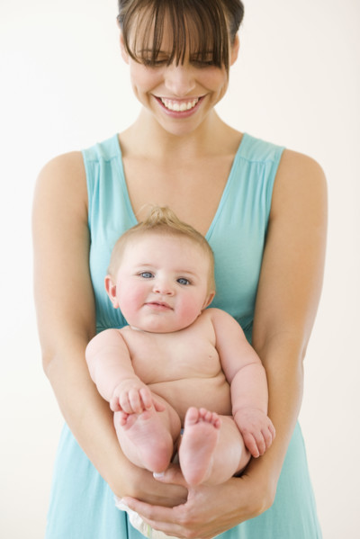 Mother holding baby. Date : 2008