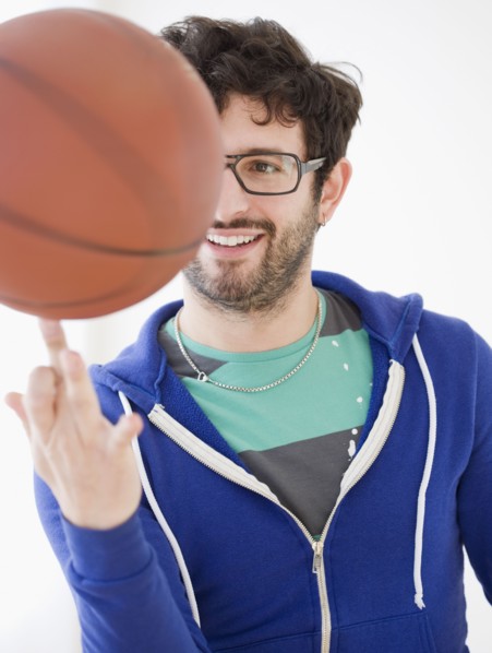 Man spinning basketball on finger. Date : 2008