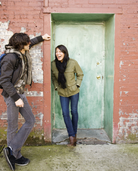 Couple talking in urban doorway. Date : 2008
