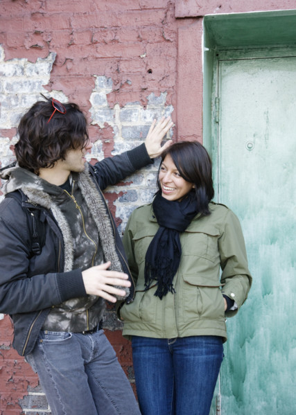 Couple talking in urban doorway. Date : 2008