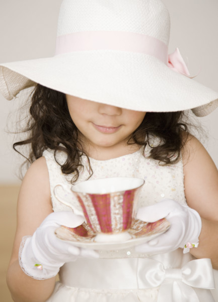 Hispanic girl dressed up at tea party. Date : 2008